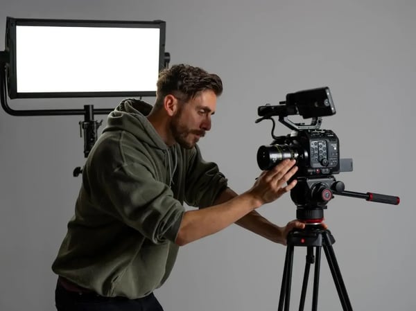 Filmmaker setting up camera for shoot.