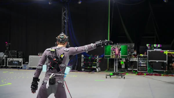 Actor in motion capture suit on film set. 