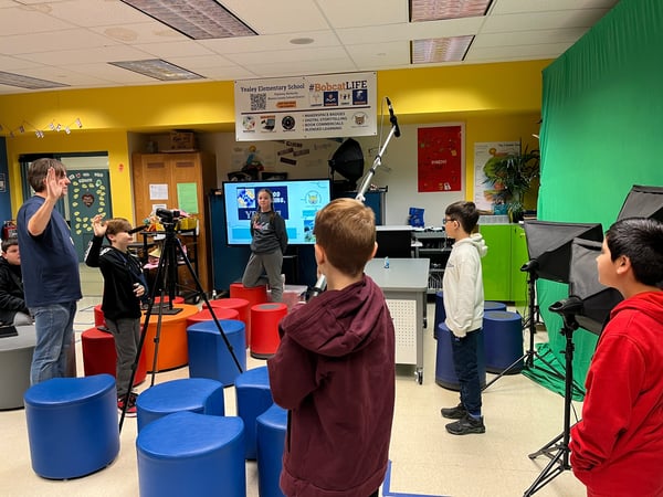 Yealey Elementary students learning video production skills in the classroom.
