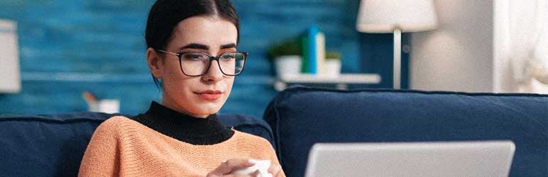 Young adult student completing an asynchronous learning module on laptop
