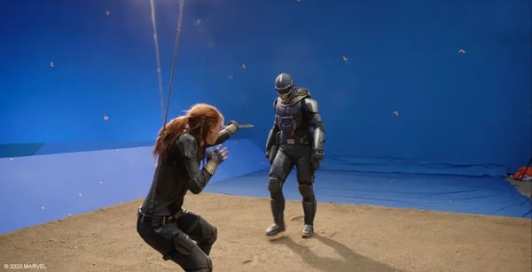 Fighting Marvel scene in front of blue screen.