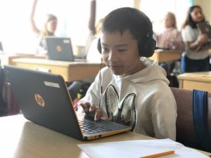 student looking at laptop