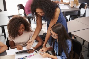 Teacher supporting students in their learning