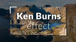 Mountains and a small town on a coastline. Supporting text: