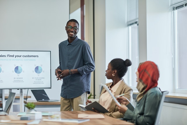 Man Presenting to Conference Room