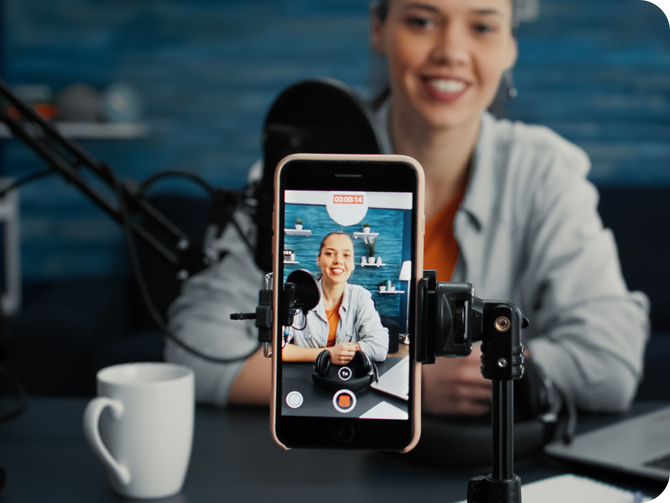 Person recording podcast on their phone.