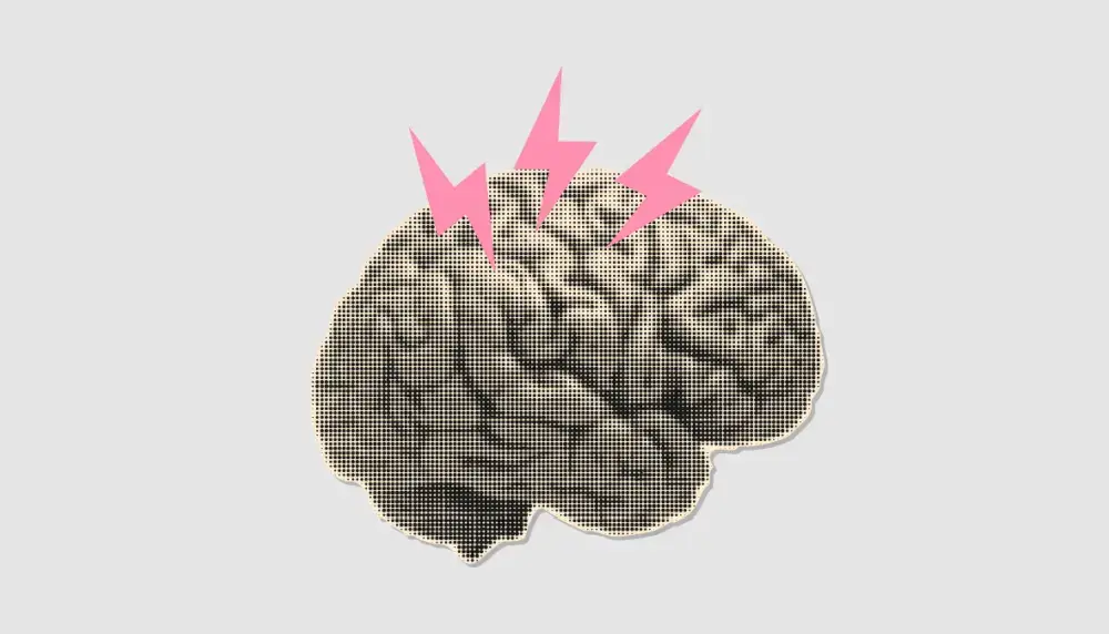 Gray brain with three pink lightning bolts over it against gray background.