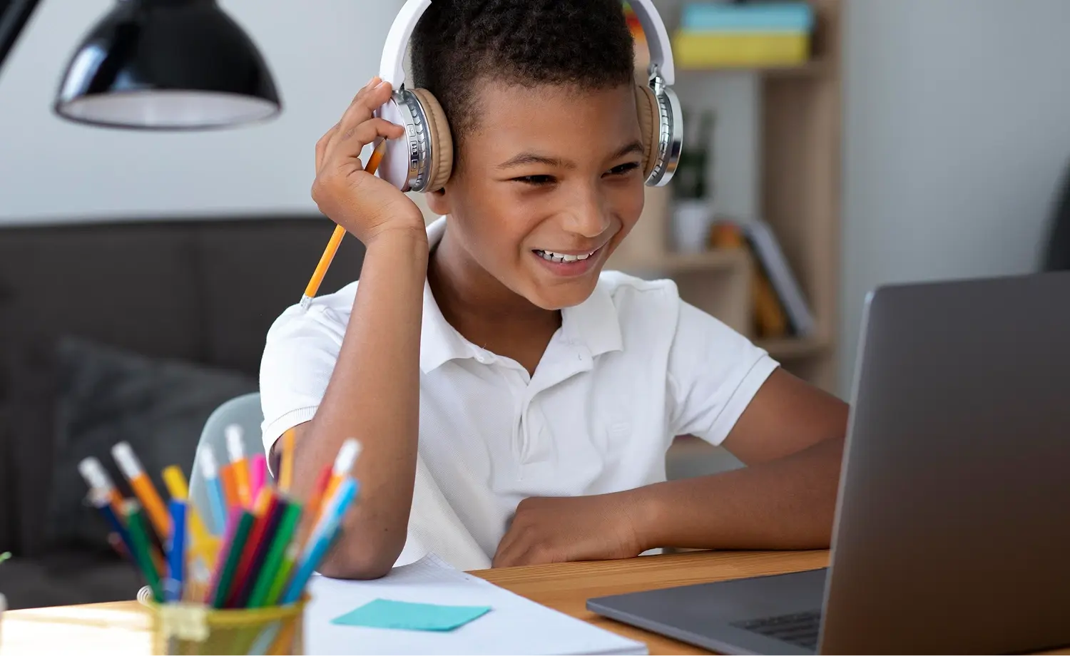 Kid focused on laptop