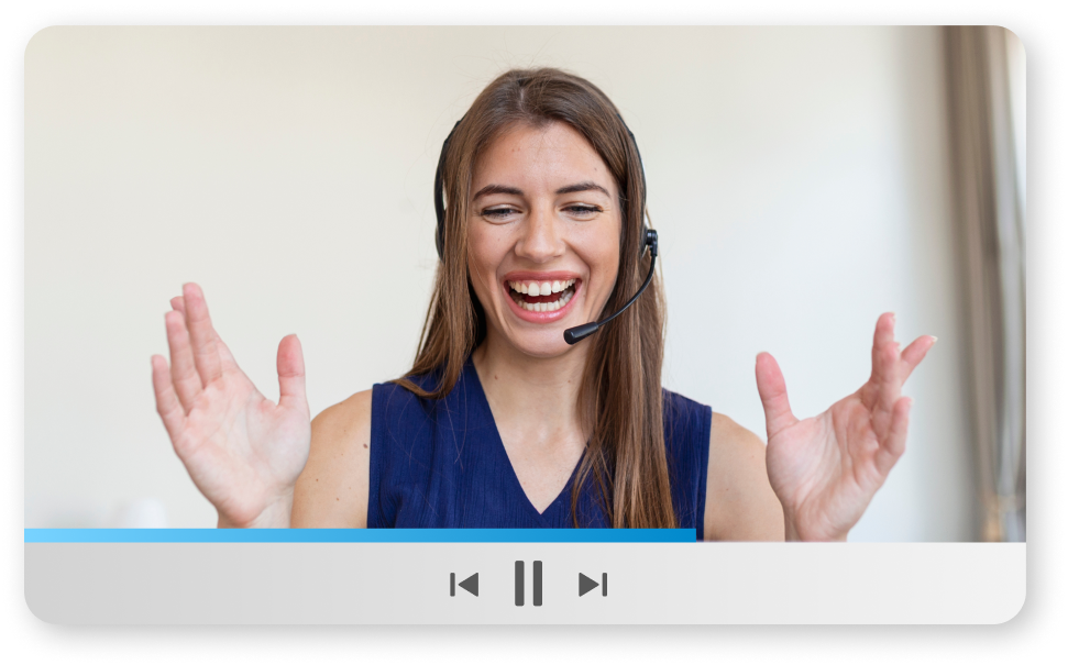 Training video playing with woman in blue blouse laughing and gesticulating toward camera. 