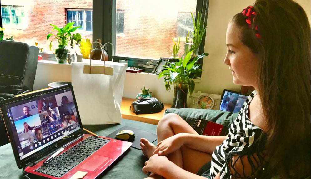 Student looking at a video conference call as if on camera. 