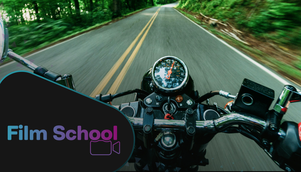 First-person POV of person riding on motorcycle. WeVideo Film School logo in bottom left corner. 