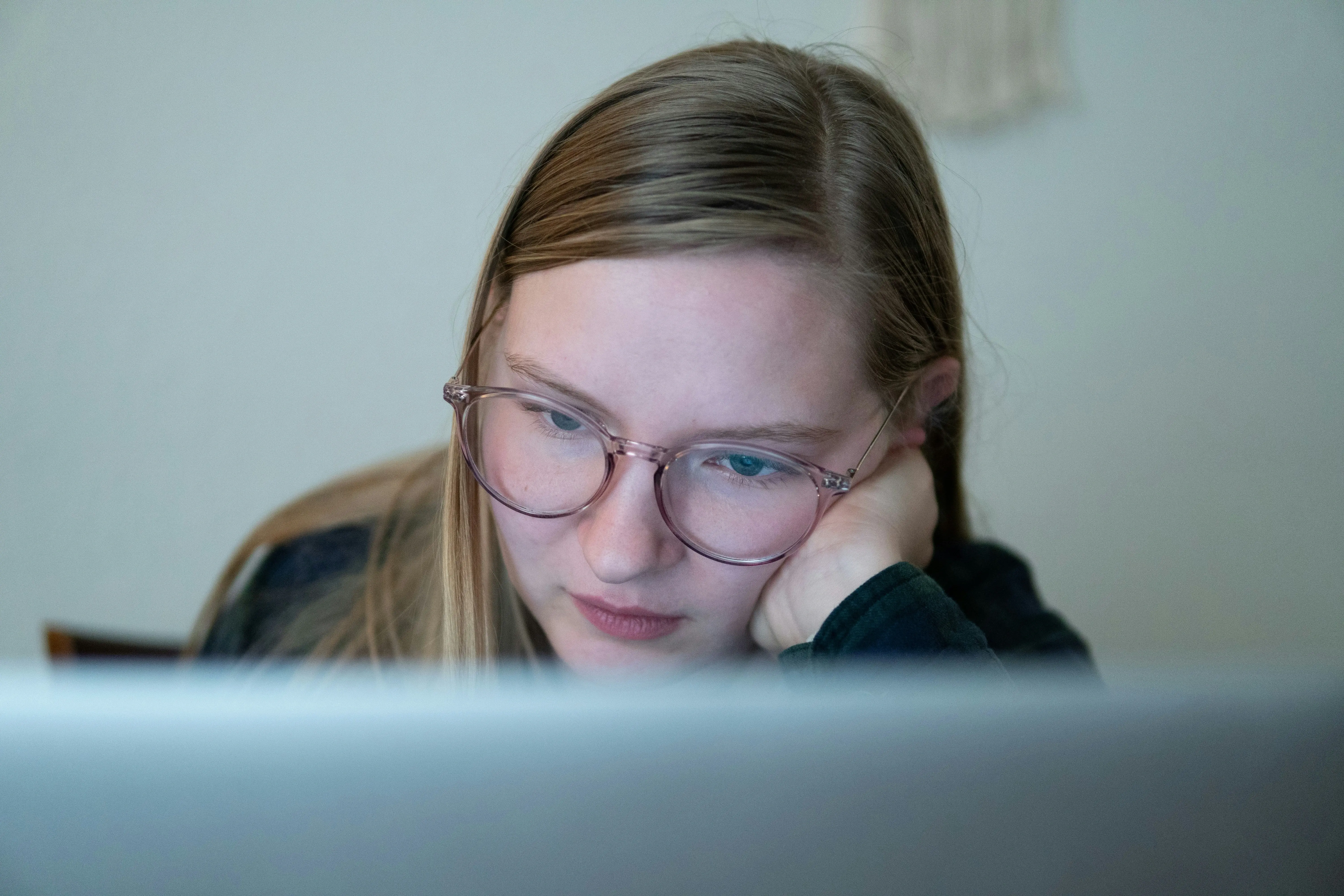 Young student working on laptop. 