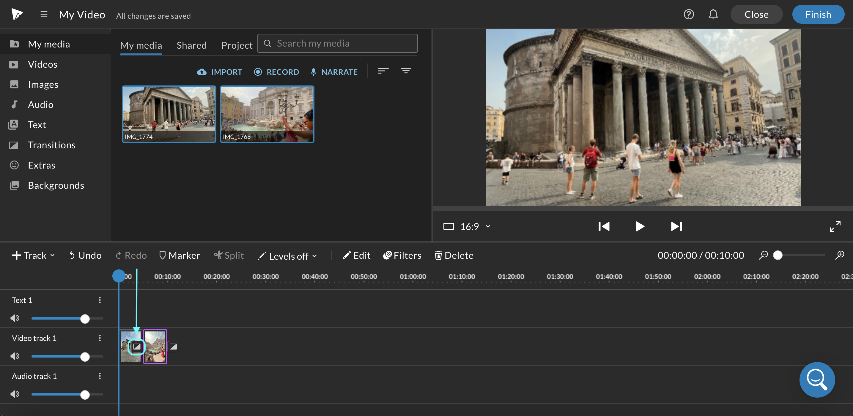 Blue arrow pointing towards the add transition between two clips in the WeVideo timeline editor.