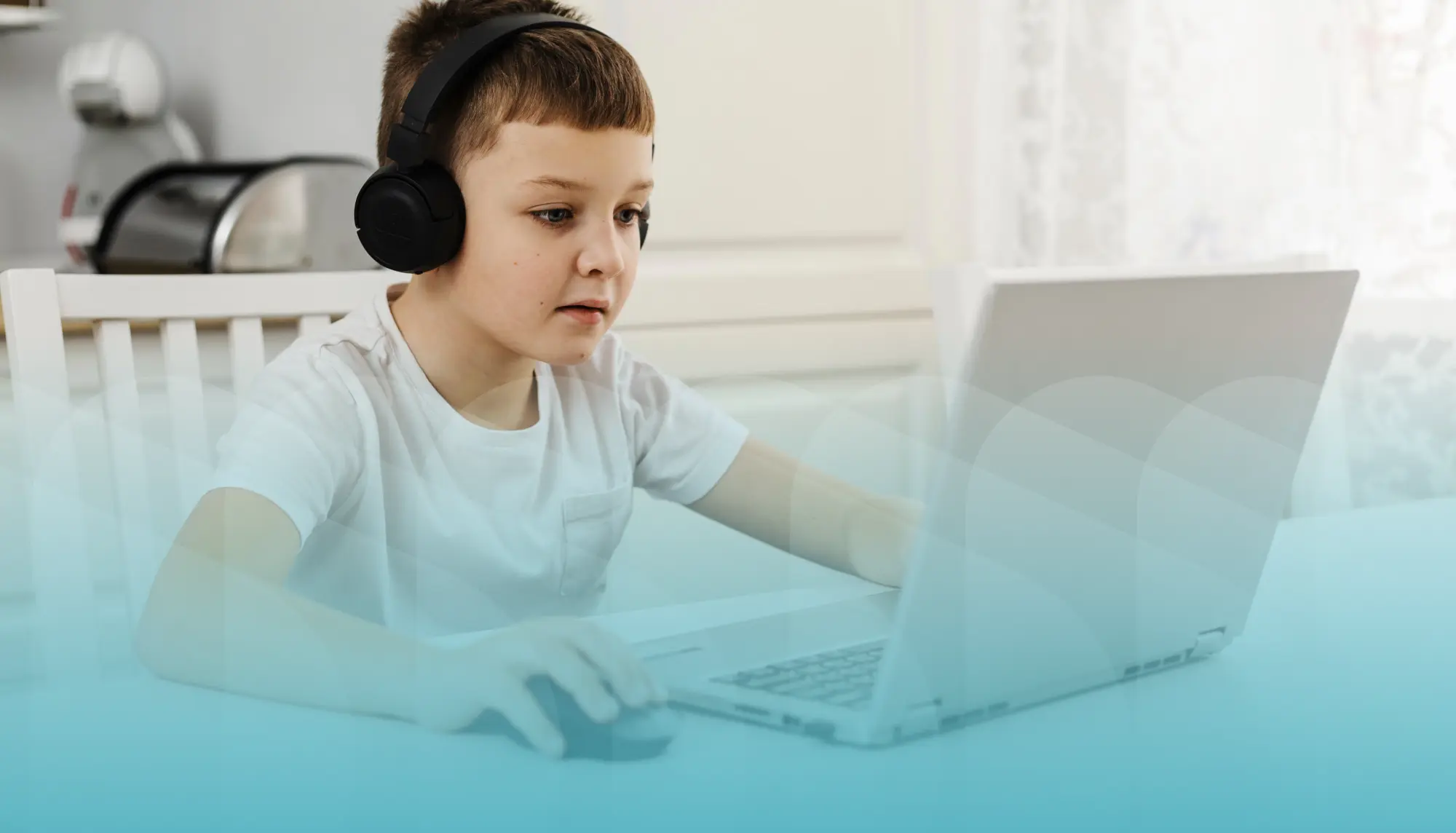 Young male student on computer with black headphones on and a light blue filter overlay on the bottom half