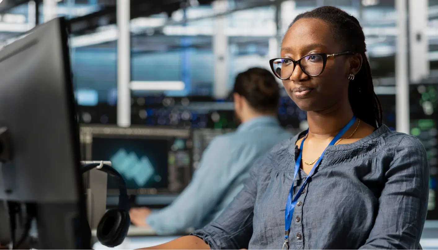 Woman analyzing data behind a computer in the edtech space
