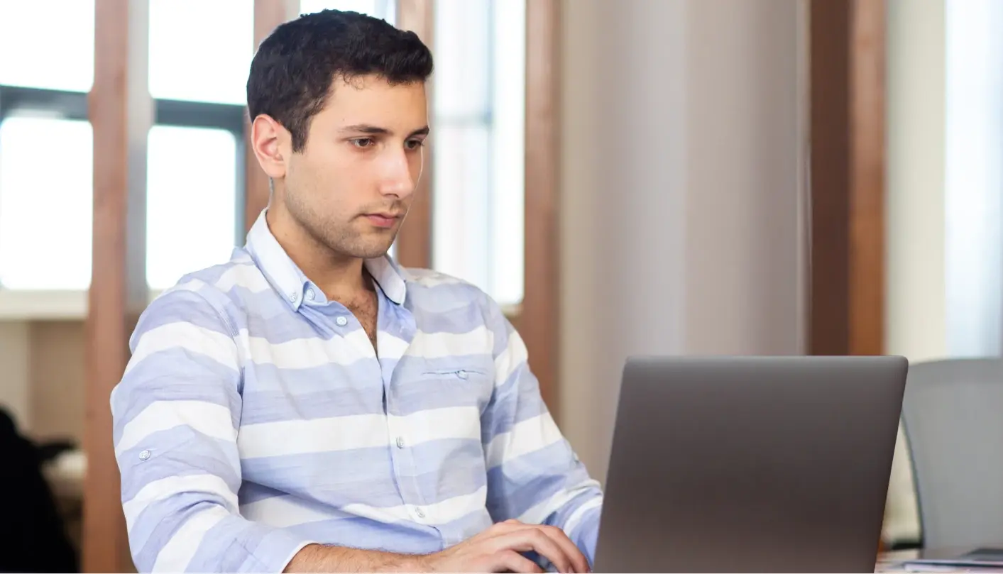 Man focused at the computer.